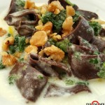 PASTA AL CACAO CON ERBETTE, FONDUTA DI TALEGGIO E NOCI