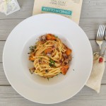 Spaghetti alle acciughe, con pomodorino giallo, filetto di cefalo affumicato e peperone crusco